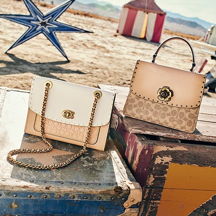 (LEFT) SIGNATURE LEATHER PARKER AT OUNASS, DHS1,950 (RIGHT) SIGNATURE CANVAS TOP HANDLE PARKER AT OUNASS, DHS2,200